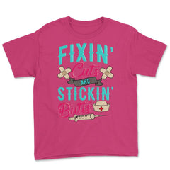 Fixin' cuts and stickin' butts Nurse Design print Youth Tee - Heliconia